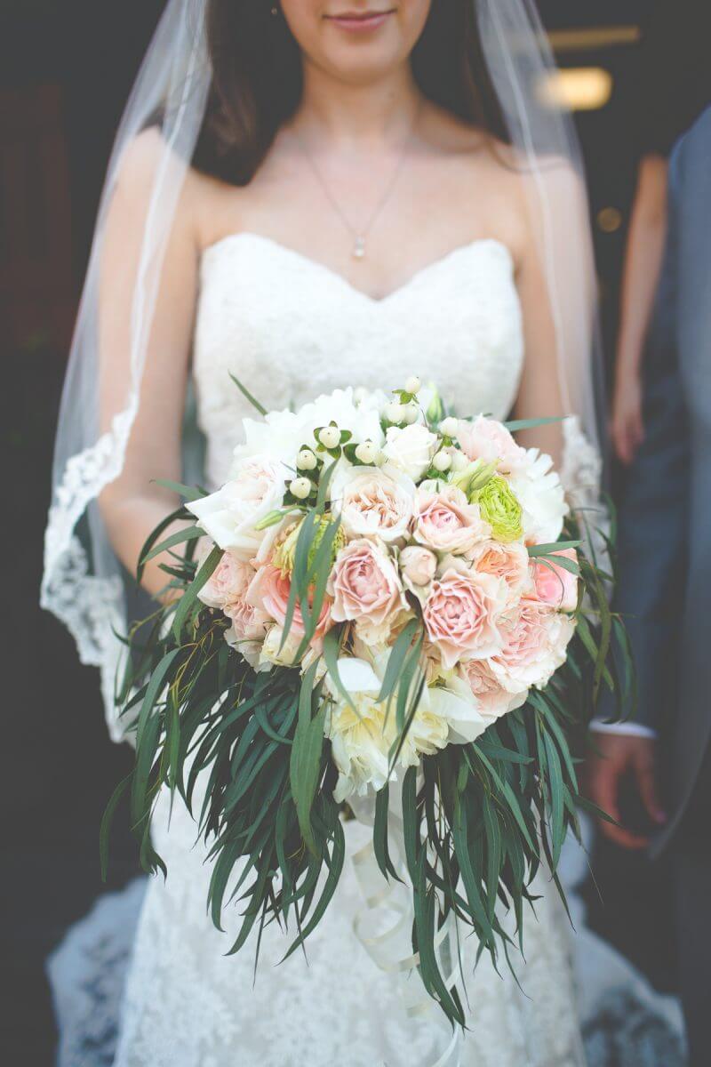 detail shot of bride's bouquet with pastel colored roses